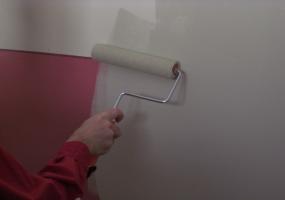 Here I'm using a new combined primer and paint product to cover a dark red paint.
