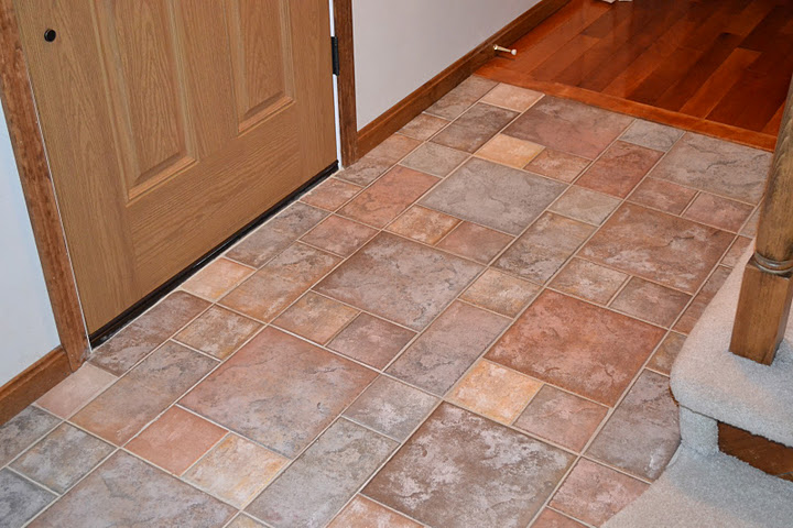 This entranceway uses ceramic tile that resembles slate tile flooring.