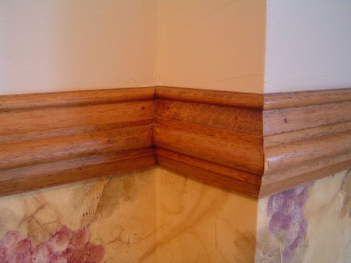 An example of how to fasten chair rail moulding to walls.
