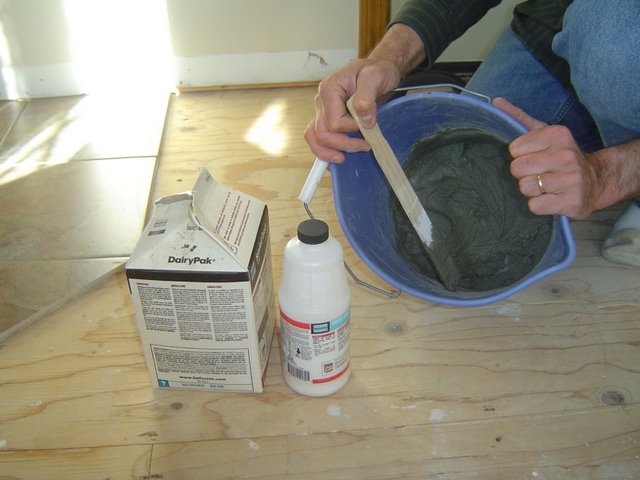 Grout and Grout Additive Solution