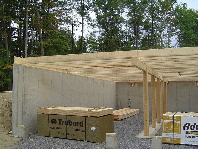 Raised floor framing over a basement and 2 car garage-under.