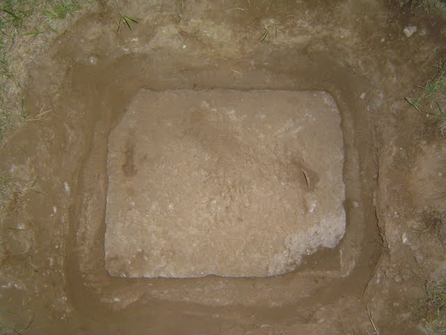 Exposed septic tank lid in preparation for a septic tank cleaning.