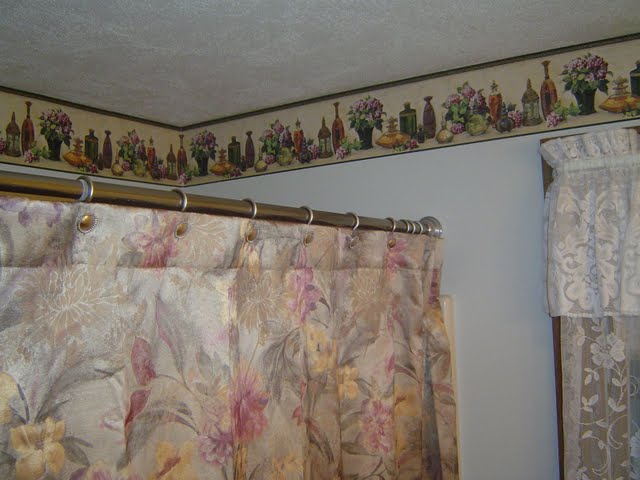 Bathroom shower curtain is an inexpensive bathroom remodeling idea.