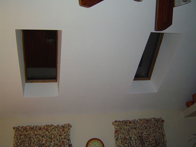 Glass skylights in a family room facing southwest.
