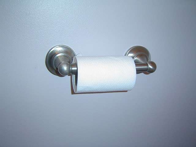Installed toilet tissue holder