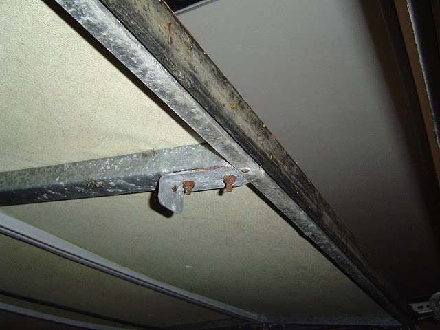 Here is a slightly worn out garage door seal attached to the bottom of a garage door.