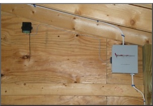 A remote control lighting system installation. A simple key size transmitter is all that is needed to remotely turn on your home's exterior lights.