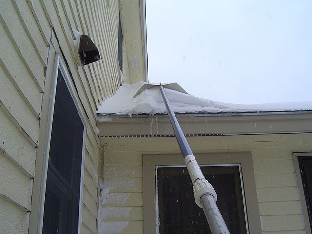 Ice dams on roofs can often be prevented by removing snow from the roof using a roof snow rake.