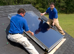 Here is a solar collector panel being installed on a roof for a solar hot water heating system.